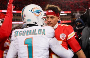 KANSAS CITY, MISSOURI - JANUARY 13: Patrick Mahomes #15 of the Kansas City Chiefs interacts with Tua Tagovailoa #1 of the Miami Dolphins after an NFL Super Wild Card Weekend playoff game at GEHA Field at Arrowhead Stadium on January 13, 2024 in Kansas City, Missouri. (Photo by Kara Durrette/Getty Images)