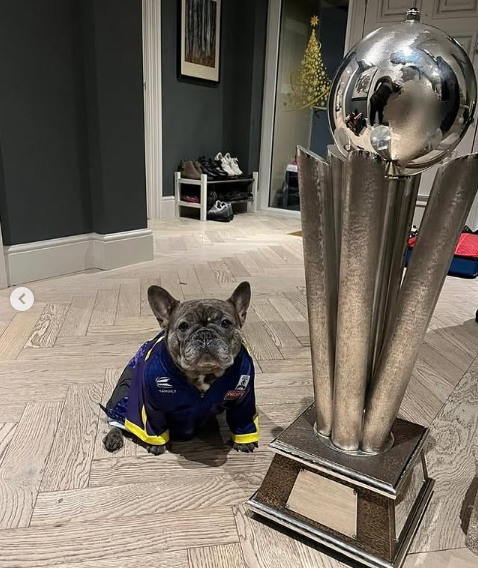 Littler's dog Nala also posed with the trophy